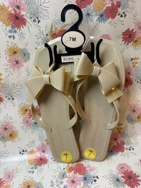 BCBGeneration Beige Bow Jelly Flip Flops